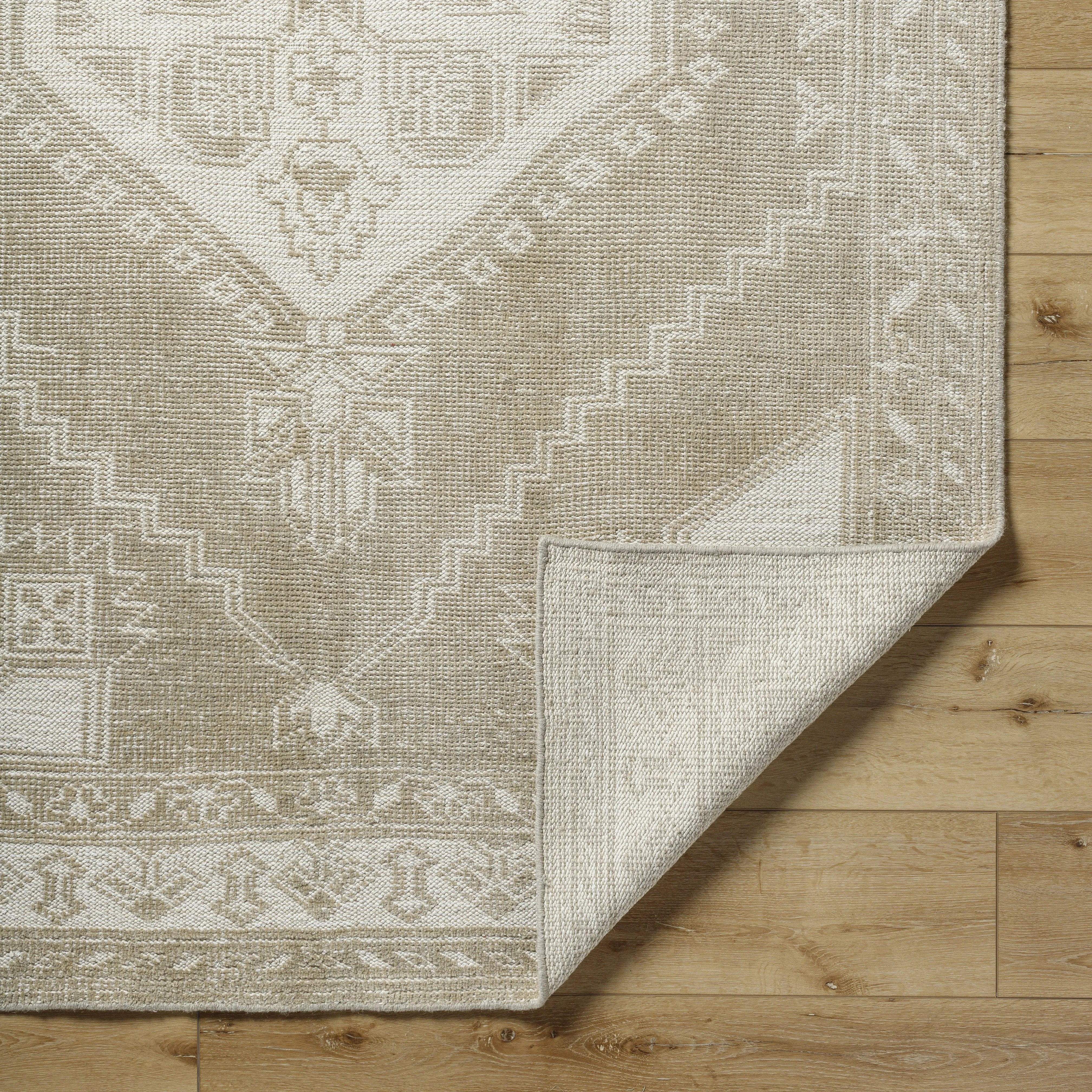 Featuring Zahra Natural Hand-Knotted Rug by Surya at Amethyst Home. The Zahra Collection showcases traditional inspired designs that exemplify timeless styles of elegance, comfort, and sophistication. With their hand knotted construction, these rugs provide a durability that can not be found in other handmade constructions, and boasts the ability to be th. Amethyst Home provides interior design, new home construction design consulting, vintage area rugs, and lighting in the Kansas City metro area.