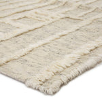 Featuring Tala Casamir Hand-Knotted Rug by Jaipur Living at Amethyst Home. The Tala Casamir Area Rug is a hand-knotted rug that brings a new sense of luxury and comfort to the contemporary home. The plush Casamir area rug makes a modern Moroccan statement, showcasing a crosshatched lattice design in an inviting cream hue with earthy toned flecks of br.  Amethyst Home provides interior design, new home construction design consulting, vintage area rugs, and lighting in the Salt Lake City metro area.