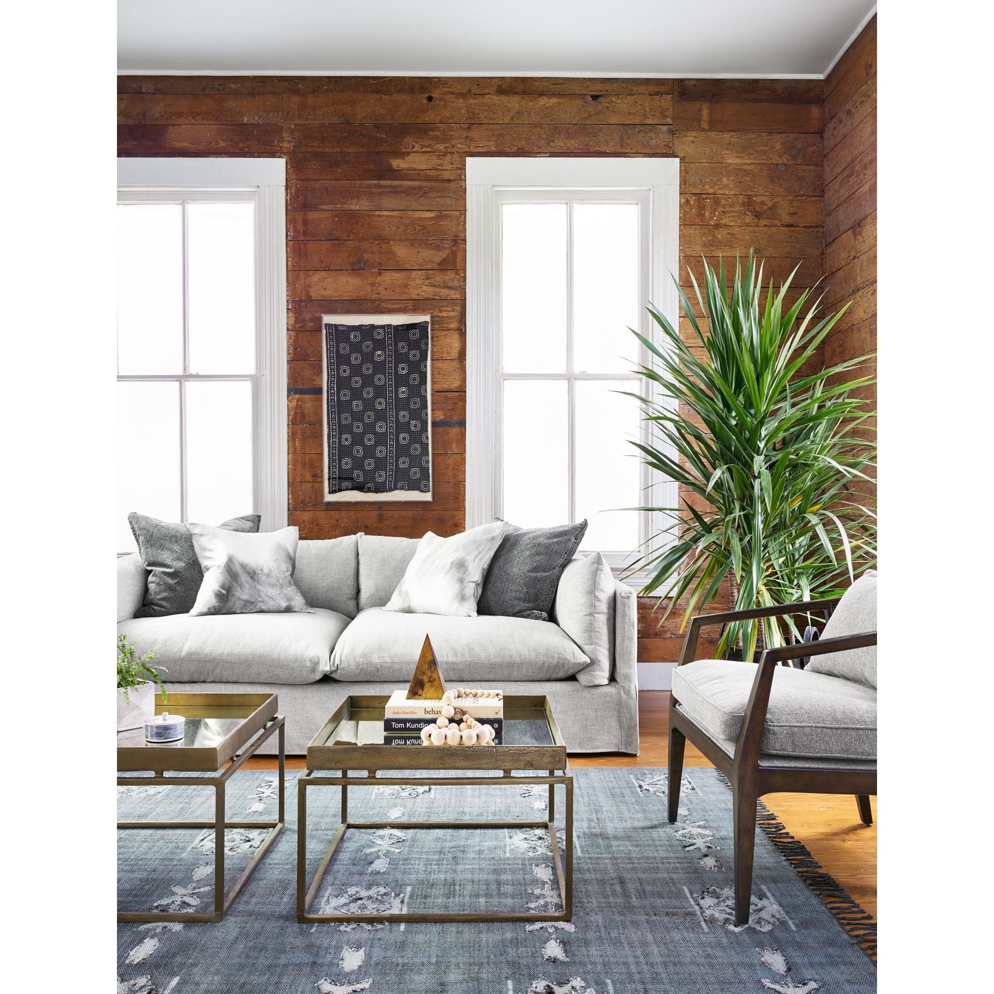 Featuring Habitat Sofa - Valley Nimbus by Four Hands at Amethyst Home. Loungey and slipcovered, the Habitat sofa is made for modern living. Shelter arms and pillow-inspired cushions are covered in comfortable, durable, and stain-resistant performance fabric. The thread within the fabric itself is doused in a material meant to prevent it from becoming sta.  Amethyst Home provides interior design, new home construction design consulting, vintage area rugs, and lighting in the Los Angeles metro area.