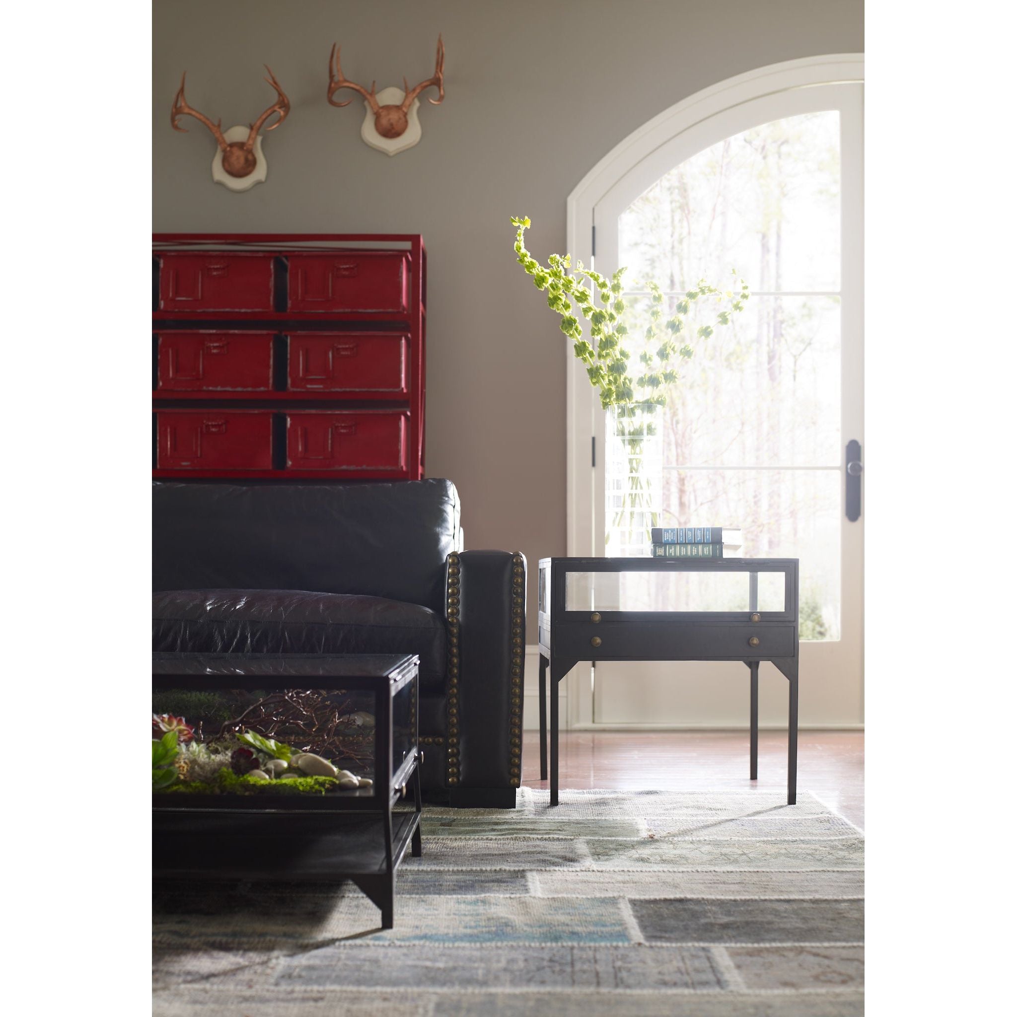 Featuring Shadow Box End Table by Four Hands at Amethyst Home. A shadowbox-inspired end table gives your inner collector a place to play. Frame prized possessions in a glass enclosure with matte-black metal and brass knobs. The perfect end table for a bed or sofa!
Overall Dimensions: 24"W x 24"L x 24"H
Colors: Black, Tempered GlassMaterials: Iron, Tempered.  Amethyst Home provides interior design, new home construction design consulting, vintage area rugs, and lighting in the Charlotte metro area.