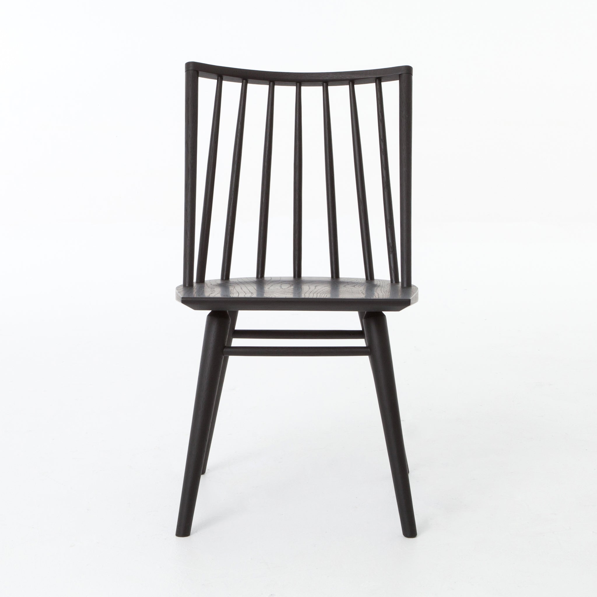 Featuring Windsor Black Oak Dining Chair by Four Hands at Amethyst Home. Try a cleaner, more modern take on the traditional Windsor with our Windsor Dining Chair. This tall beauty is wire-brushed to bring out the cathedral grain in the oak, and stained deep black for lovely contrast with more industrial decor. This chair is super comfortable and perfect for a .  Amethyst Home provides interior design, new home construction design consulting, vintage area rugs, and lighting in the Tampa metro area.
