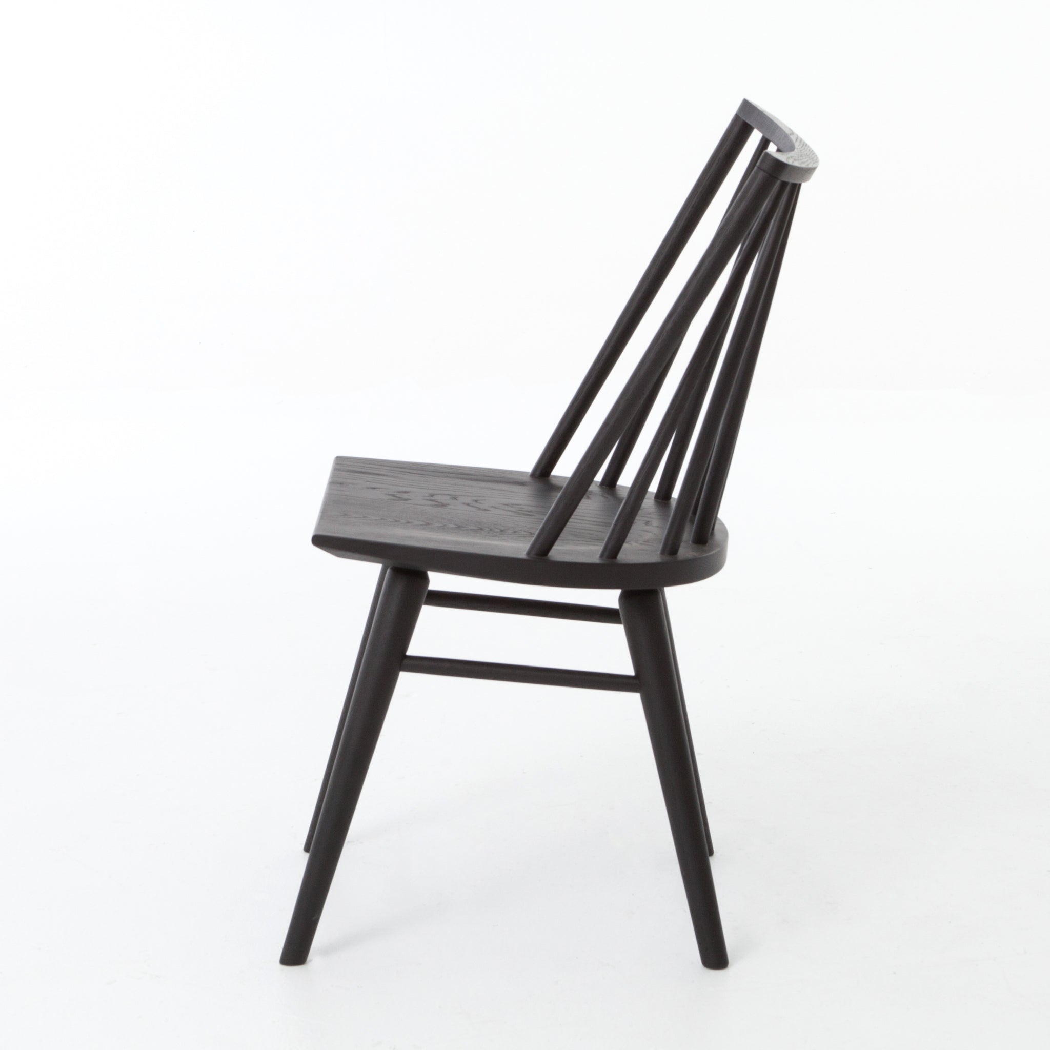 Featuring Windsor Black Oak Dining Chair by Four Hands at Amethyst Home. Try a cleaner, more modern take on the traditional Windsor with our Windsor Dining Chair. This tall beauty is wire-brushed to bring out the cathedral grain in the oak, and stained deep black for lovely contrast with more industrial decor. This chair is super comfortable and perfect fo.  Amethyst Home provides interior design, new home construction design consulting, vintage area rugs, and lighting in the Nashville metro area.