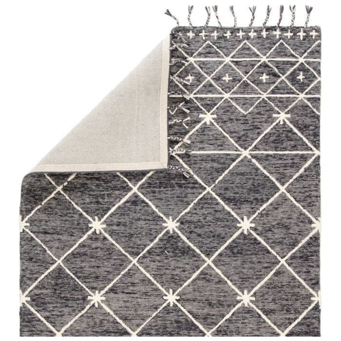 Featuring Vera Rhea Hand-Knotted Rug by Jaipur Living at Amethyst Home. Hand-tufted of wool, the Vera collection by Nikki Chu infuses contemporary spaces with inspiring patterns and versatile colorways. The glam-meets-global Rhea rug features an ivory Moroccan-inspired trellis design that covers the gray and black backdrop with a space-dyed effect. Long, .  Amethyst Home provides interior design, new home construction design consulting, vintage area rugs, and lighting in the Washington metro area.