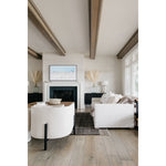 A piece we lovingly refer to as the "three legged-dog" to our clients, the Sullivan chair from Verellen is a beautiful statement piece from every angle. The 360 degree attention to detail makes it a striking piece in open concept spaces. This chair sits wonderfully for mounted televisions or with conversation and a glass of wine in the evening.  Select from Ash wood or Walnut legs.  33”w X 34”d x 28”/30”h