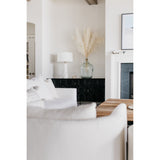 A piece we lovingly refer to as the "three legged-dog" to our clients, the Sullivan chair from Verellen is a beautiful statement piece from every angle. The 360 degree attention to detail makes it a striking piece in open concept spaces. This chair sits wonderfully for mounted televisions or with conversation and a glass of wine in the evening.  Select from Ash wood or Walnut legs.  33”w X 34”d x 28”/30”h