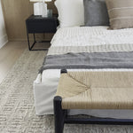 Cisco Brothers April Bed is designed and constructed in Los Angeles. The pinched edges and clean lines bring a modern, minimalist feel to any bedroom. Photographed in White Denim and Bengal Pin Striped Indigo. Amethyst Home provides interior design, new home construction design consulting, vintage area rugs, and lighting in the Scottsdale metro area.