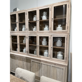 Featuring Haley Cabinet by Dovetail at Amethyst Home. The Haley Cabinet has ample storage, with glass door panels opening to shelves and a bottom sliding door that opens to more shelves. Made from reclaimed pine with a white wash grey sealed finish, this brings an antique feel to any room.
Reclaimed Pine 
White Wash Grey Sealed Finish
Flat Glass Door Pan.  Amethyst Home provides interior design, new home construction design consulting, vintage area rugs, and lighting in the Portland metro area.