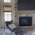 This gorgeous custom leather ottoman, the Brando Leather Ottoman by Cisco Brothers, pairs well with our Brando Chair, also from Cisco Brothers. As shown in Spur Terracotta in a Grade 500 leather. Lifestyle shots in the dark leather are discontinued.  Ottoman size: 25"w x 20"d x 16.5"h