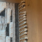 A nod to timeless Moroccan style, the Khalid Collection is hand-knotted in India by skilled artisans. The soft pile features 100% natural, undyed wool, lending slight variations in tones that make each piece it's own. Plus, each rug is finished with a thoughtfully designed fringe.  Hand Knotted 100% Wool KF-02 Natural/Black