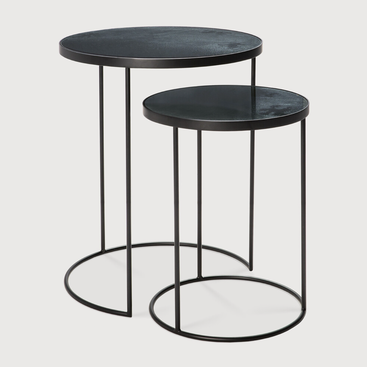 Featuring Nesting Side Table Set - Charcoal by Ethnicraft at Amethyst Home. Featuring a heavy aged mirror surface, this Charcoal Nesting Side Table Set brings a unique look to any space. Place beside the sofa, sitting next to your bed, or as a complementary piece to a work of art, its adaptability offers many possibilities.
Dimensions: 22.5"w x 22.5"d .  Amethyst Home provides interior design, new home construction design consulting, vintage area rugs, and lighting in the Newport Beach metro area.