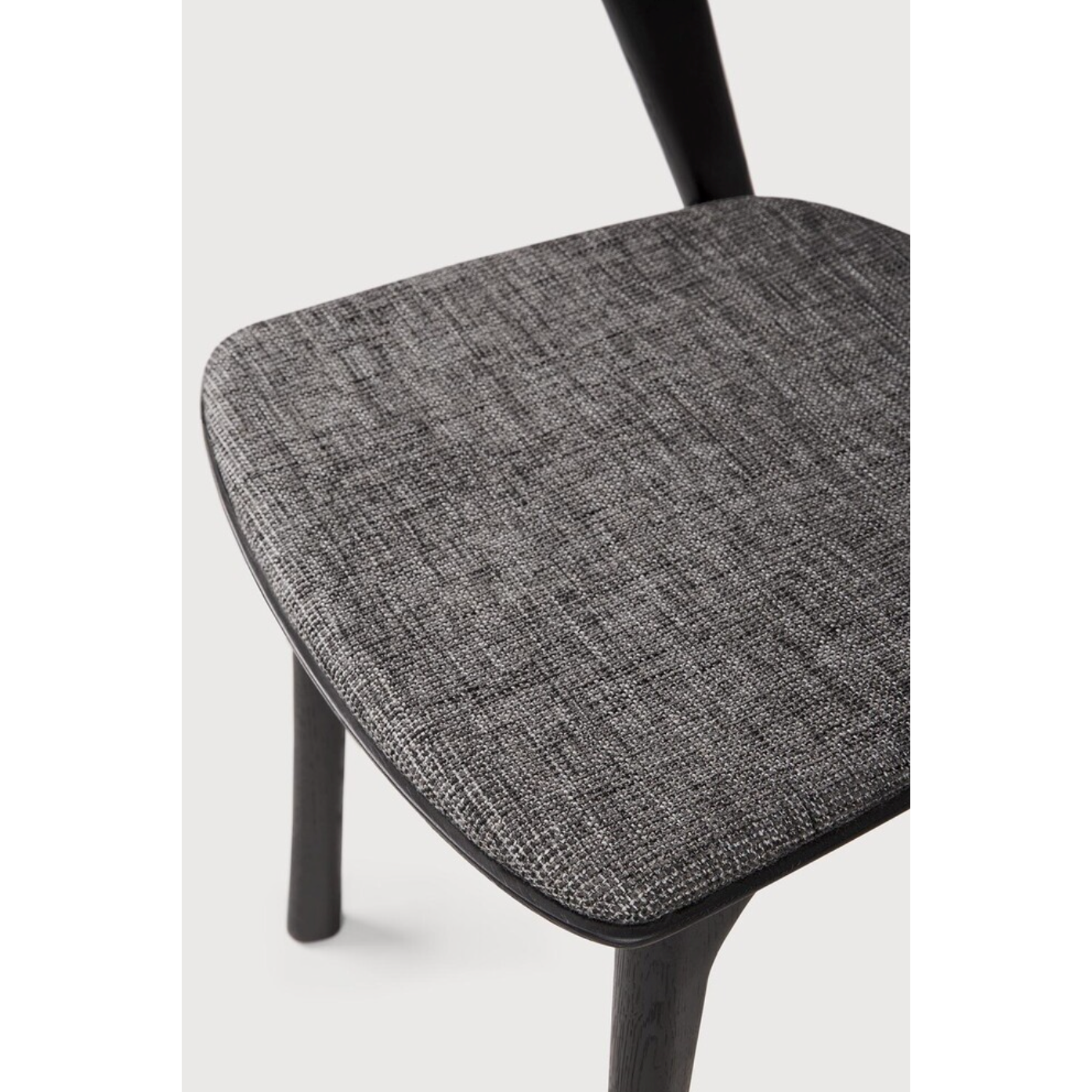 Featuring Oak Bok Dining Chair - Black - Grey by Ethnicraft at Amethyst Home. This Oak Bok Dining Chair features an airy shape with rock-solid construction,  making this piece a timeless and remarkable design to enjoy for years to come. Pair with a dining table or stand-alone against a wall, hallway, or end of the bed! Designed by Alain can Havre
Dimensions: .  Amethyst Home provides interior design, new home construction design consulting, vintage area rugs, and lighting in the Boston metro area.