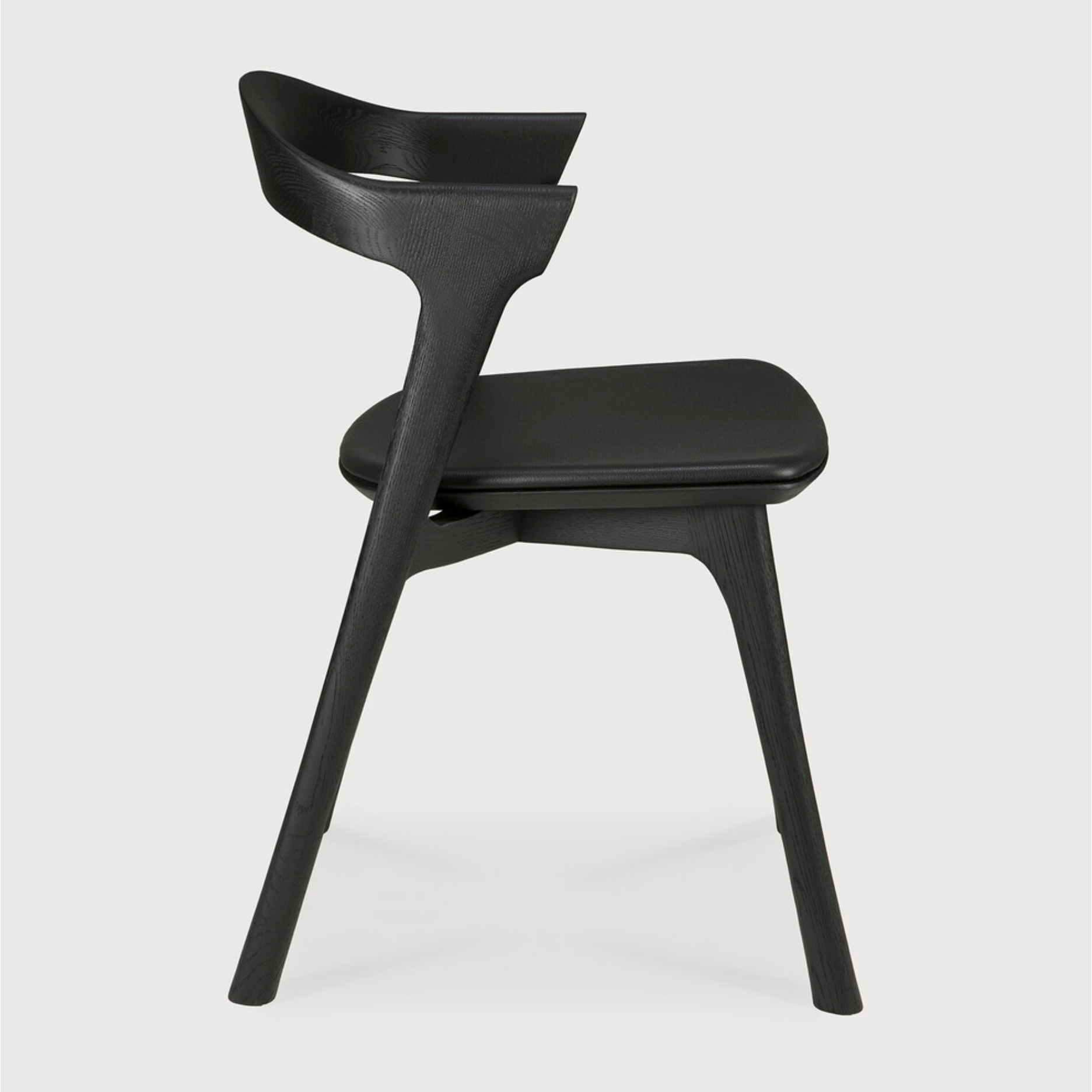 Featuring Oak Bok Dining Chair - Black - Black Leather by Ethnicraft at Amethyst Home. This Oak Bok Dining Chair features an airy shape with rock-solid construction,  making this piece a timeless and remarkable design to enjoy for years to come. Pair with a dining table or stand-alone against a wall, hallway, or end of the bed! Designed by Alain can Havre
Dim.  Amethyst Home provides interior design, new home construction design consulting, vintage area rugs, and lighting in the Austin metro area.