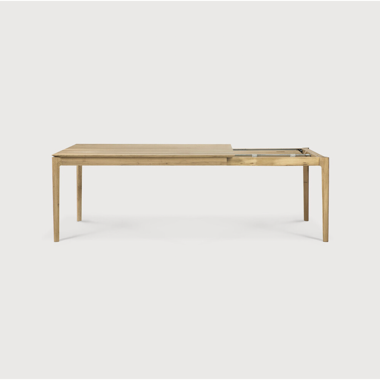 Featuring Oak Bok Extendable Dining Table by Ethnicraft at Amethyst Home. This Oak Bok Extendable Dining Table is perfect for families who want extra space when their kids, extended family, or guests come to celebrate! Its airy shape yet rock solid construction make this piece a timeless and remarkable design to enjoy for years to come.
Material: Oak, 100.  Amethyst Home provides interior design, new home construction design consulting, vintage area rugs, and lighting in the Washington metro area.