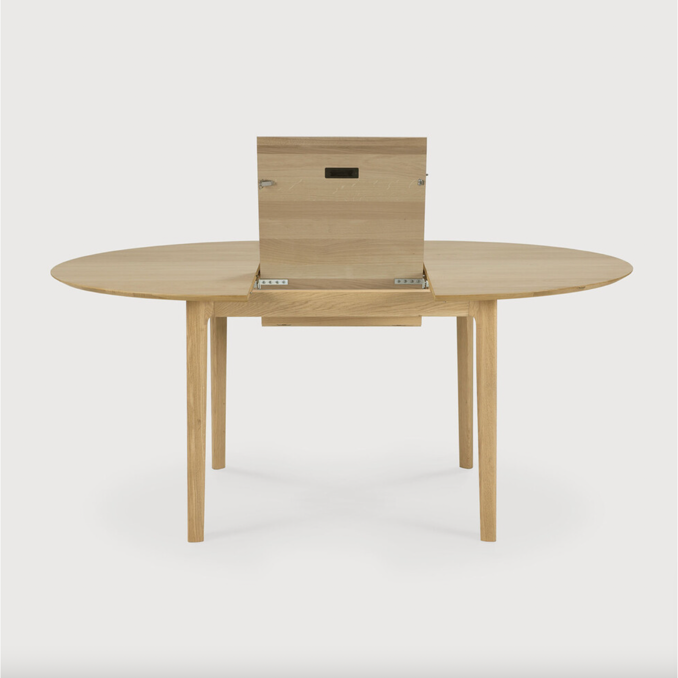 Featuring Oak Bok Round Extendable Dining Table by Ethnicraft at Amethyst Home. This Oak Bok Round Extendable Dining Table offers the perfect solution for adaptable dining within a smaller space. The iconic airy shape and solid construction make for a timeless design to enjoy for years to come.
Material: Oak, 100% Solid WoodFinish: Oiled
Dimensions: 51.  Amethyst Home provides interior design, new home construction design consulting, vintage area rugs, and lighting in the Winter Garden metro area.