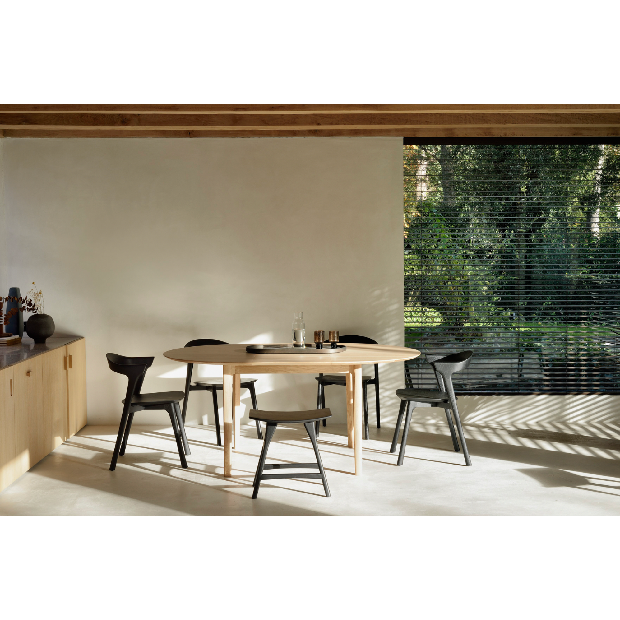 Featuring Oak Bok Round Extendable Dining Table by Ethnicraft at Amethyst Home. This Oak Bok Round Extendable Dining Table offers the perfect solution for adaptable dining within a smaller space. The iconic airy shape and solid construction make for a timeless design to enjoy for years to come.
Material: Oak, 100% Solid WoodFinish: Oiled
Dimensions: 51"w.  Amethyst Home provides interior design, new home construction design consulting, vintage area rugs, and lighting in the Los Angeles metro area.