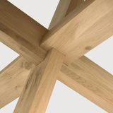 Featuring Oak Circle Round Dining Table by Ethnicraft at Amethyst Home. This Oak Circle Round Dining Table is all about inspiring your family to spend a little more time at the table. The solid legs intertwine in perfect balance to create a unique, bright look to any kitchen or dining area. 
Material: Oak, 100% Solid WoodFinish: Varnished
Dimensions 54": 54.  Amethyst Home provides interior design, new home construction design consulting, vintage area rugs, and lighting in the Portland metro area.