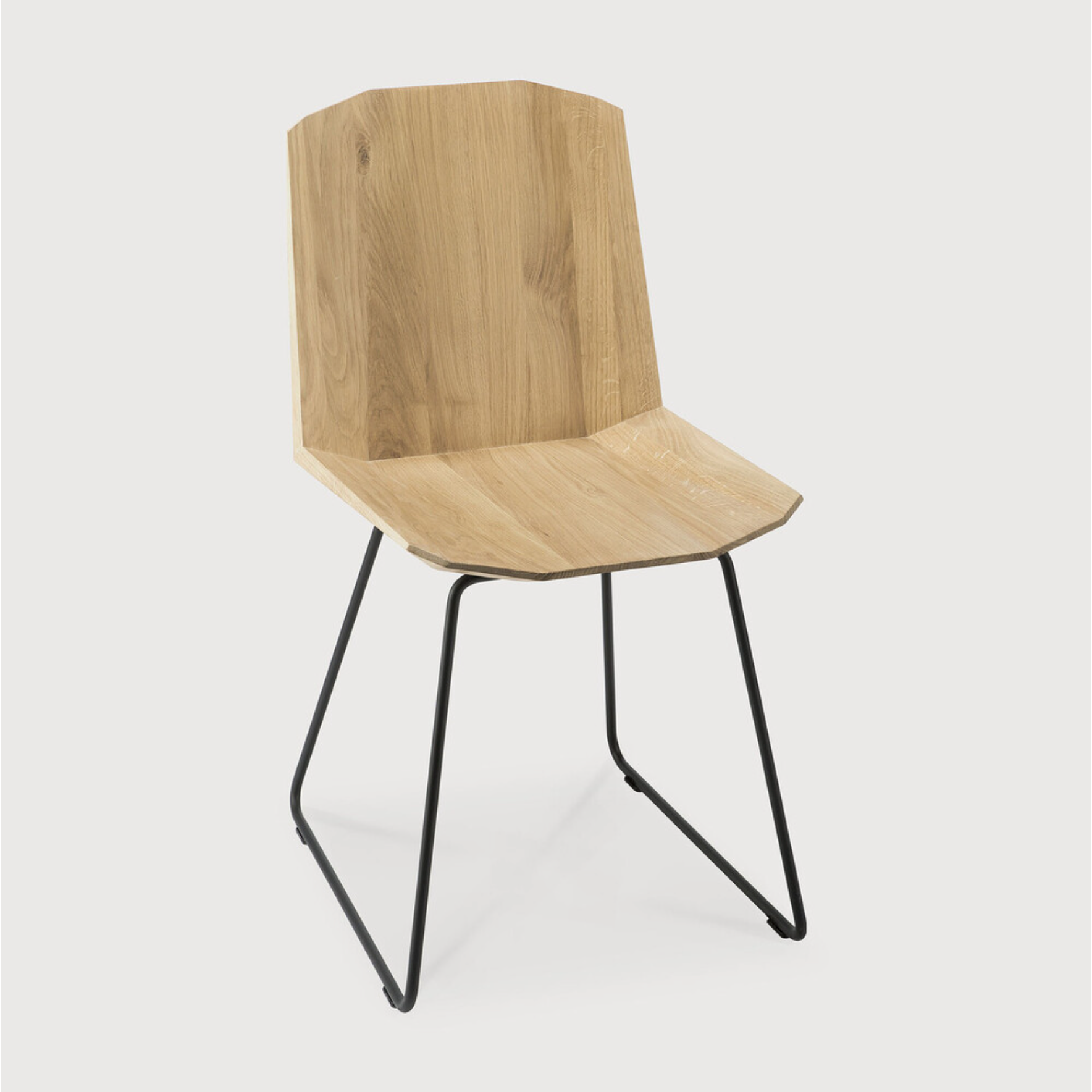 Featuring Oak Facette Dining Chair by Ethnicraft at Amethyst Home. This Oak Facette Dining Chair is both timeless, yet reflecting. We are so intrigued by this chair's ingenious wooden structure that is divided into facets, which makes the seating more comfortable and unique. This beautiful chair will add a sculptural element to your dining table or kitchen!.  Amethyst Home provides interior design, new home construction design consulting, vintage area rugs, and lighting in the Monterey metro area.