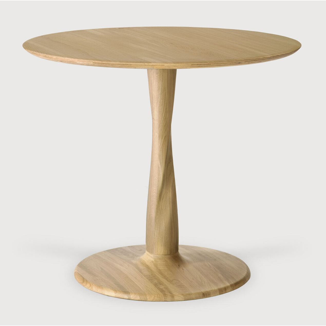 Featuring Oak Round Torsion Dining Table by Ethnicraft at Amethyst Home. Airy with subtle complexities, this Oak Round Torsion Dining Table incorporates advanced woodworking techniques to create a light table top with a torsaded base of sculptural elegance -- sure to elevate the look for any dining or kitchen area. 
Material: Oak, 100% Solid WoodFinis.  Amethyst Home provides interior design, new home construction design consulting, vintage area rugs, and lighting in the Salt Lake City metro area.