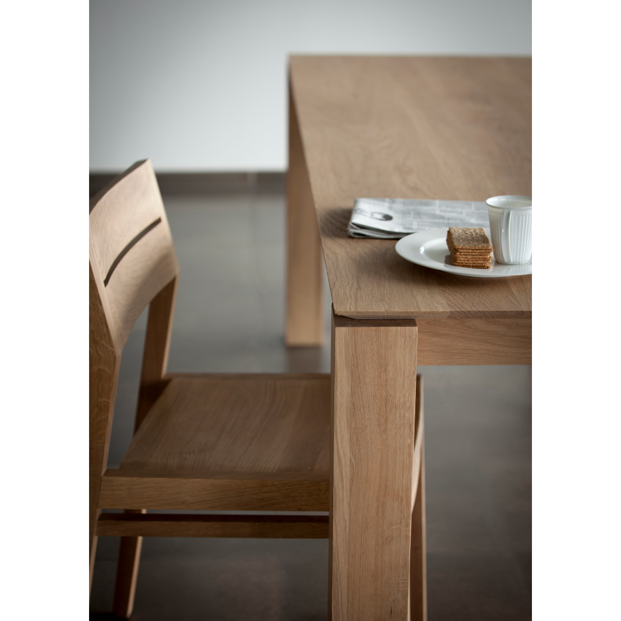 Featuring Oak Slice Dining Table by Ethnicraft at Amethyst Home. A seemingly simple and straightforward piece, the Oak Slice Dining Table features subtle corner details that add playful sophistication to the functional piece. A piece to gather your family and friends around for years to come. 
Material: Oak, 100% Solid WoodFinish: Oil
Dimensions 63": 63"w.  Amethyst Home provides interior design, new home construction design consulting, vintage area rugs, and lighting in the Washington metro area.