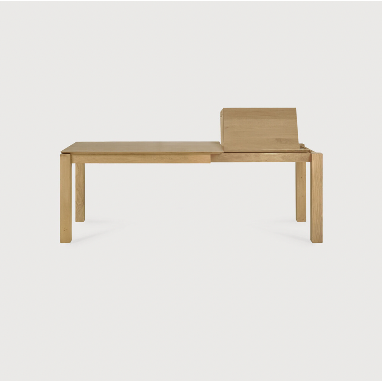 Featuring Oak Slice Extendable Dining Table by Ethnicraft at Amethyst Home. This Oak Slice Extendable Dining Table bevelled edges give it a unique character, but there's also a little extra added. This table can easily be extended without interruption of the wood grain pattern -- perfect for gathering your family or friends for hosting parties or the holi.  Amethyst Home provides interior design, new home construction design consulting, vintage area rugs, and lighting in the Washington metro area.