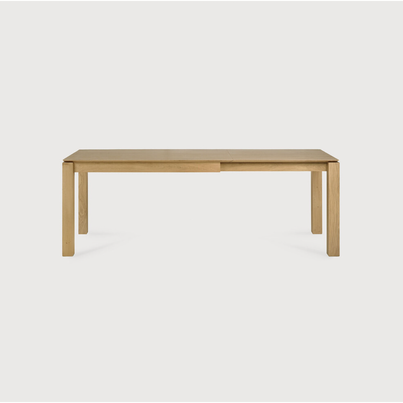 Featuring Oak Slice Extendable Dining Table by Ethnicraft at Amethyst Home. This Oak Slice Extendable Dining Table bevelled edges give it a unique character, but there's also a little extra added. This table can easily be extended without interruption of the wood grain pattern -- perfect for gathering your family or friends for hosting parties or the holidays.  Amethyst Home provides interior design, new home construction design consulting, vintage area rugs, and lighting in the Boston metro area.