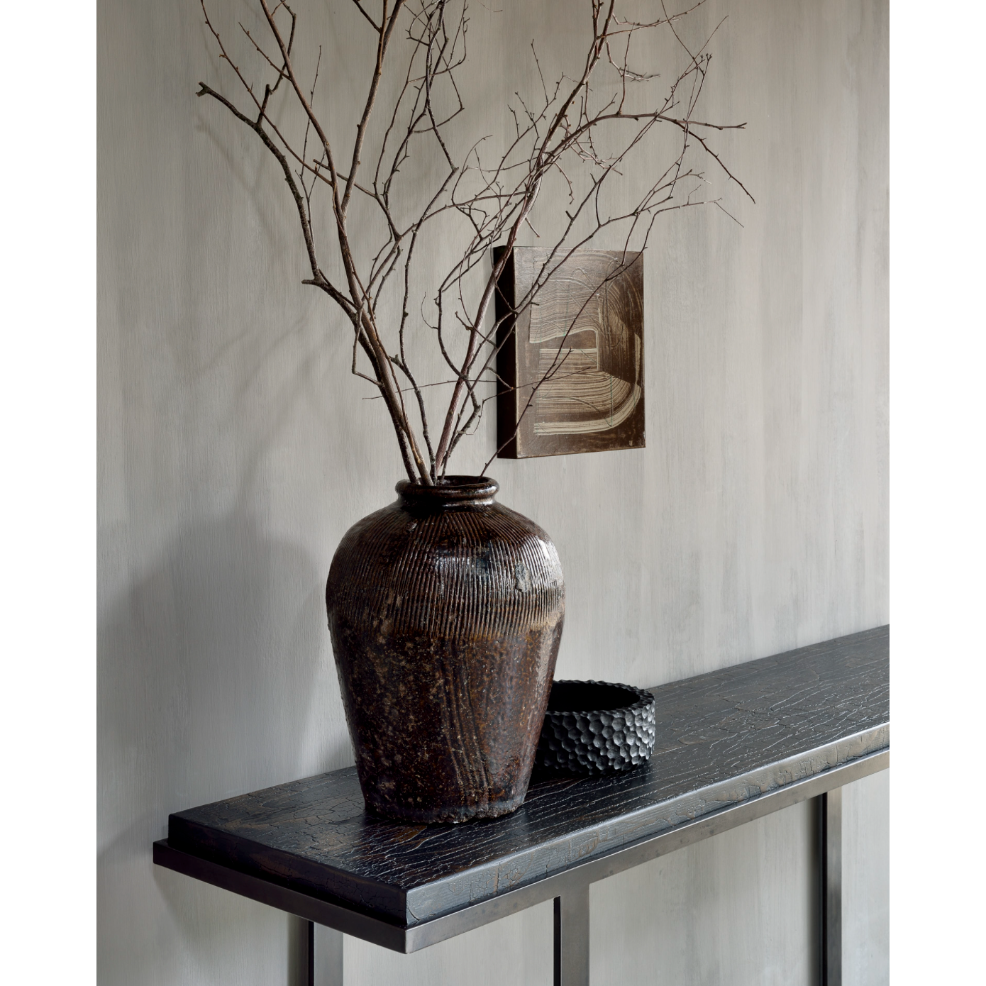 Featuring Stability Console Table - Umber by Ethnicraft at Amethyst Home. The deep surface of the Stability console is shaped by hand by skilled artisans. Natural mineral powders and color pigments blend to form the console's unique finish. We love how this piece's simple lines showcase the clean beauty of well-crafted metal work. We imagine this unique p.  Amethyst Home provides interior design, new home construction design consulting, vintage area rugs, and lighting in the Des Moines metro area.