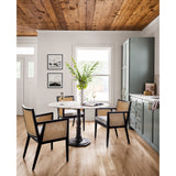 Featuring Antonia Cane Brushed Ebony Dining Armchair by Four Hands at Amethyst Home. We loved the retro look of this Antonia Cane Dining Armchair - Brushed Ebony. The brushed ebony nettlewood frames paired with the natural cane brings the perfect contract to any dining room or kitchen area. 
Overall Dimensions: 22.75"W x 23.50"L x 33"HColors: Light Natur.  Amethyst Home provides interior design, new home construction design consulting, vintage area rugs, and lighting in the Los Angeles metro area.