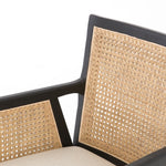 Featuring Antonia Cane Brushed Ebony Dining Armchair by Four Hands at Amethyst Home. We loved the retro look of this Antonia Cane Dining Armchair - Brushed Ebony. The brushed ebony nettlewood frames paired with the natural cane brings the perfect contract to any dining room or kitchen area. 
Overall Dimensions: 22.75"W x 23.50"L x 33"HColors: Light Natural Ca.  Amethyst Home provides interior design, new home construction design consulting, vintage area rugs, and lighting in the Austin metro area.