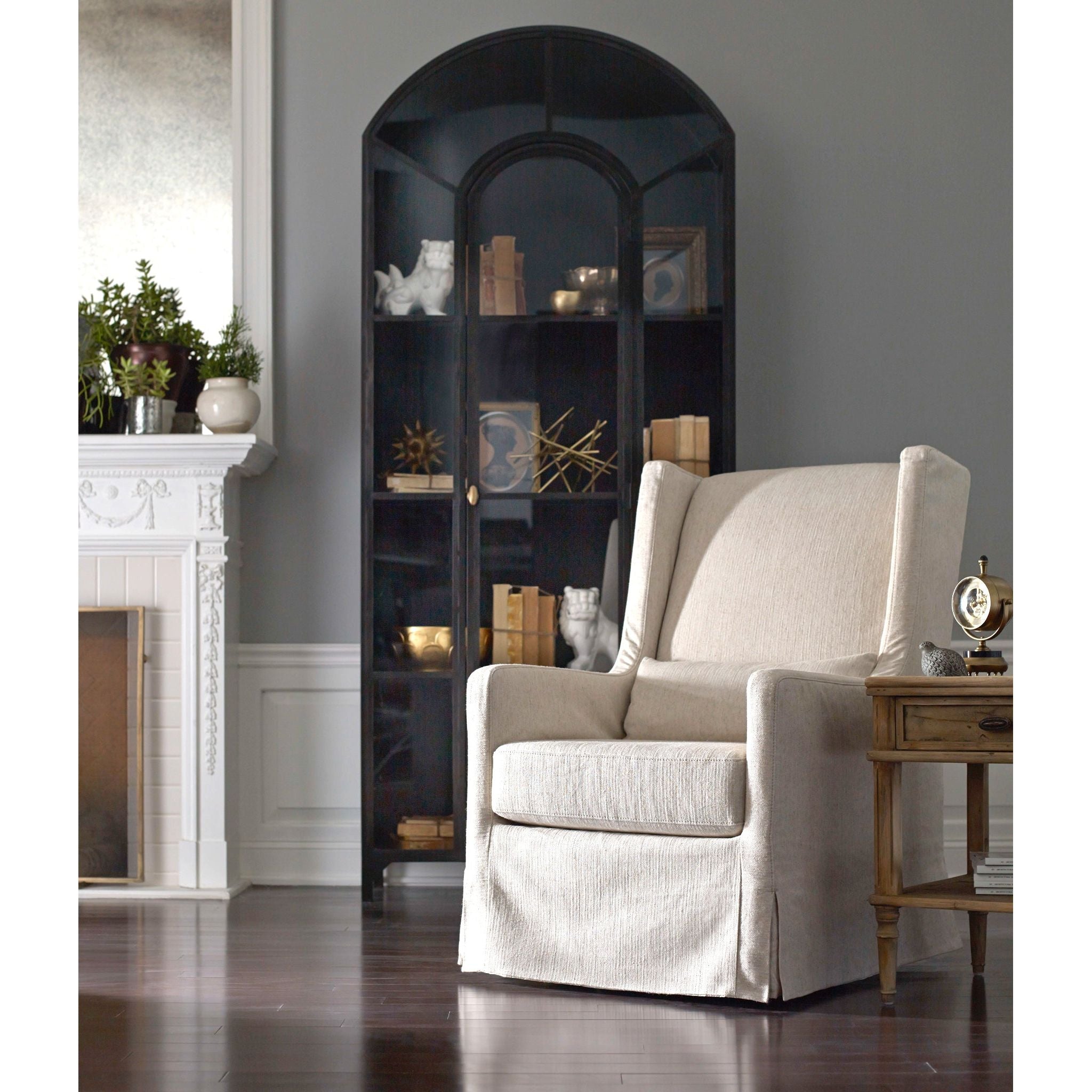 Featuring Belmont Black Iron Cabinet by Four Hands at Amethyst Home. Display barware, books, or other treasures in an arch-topped cabinet. Solid iron sheeting is finished in soft, matte black with contrasting brass hardware.
Overall Dimensions: 39.50"W x 15.75"L x 92.50"HColors: Black, Clear Glass, Weathered BronzeMaterials: Iron, GlassWeight: 229.94 lb. Amethyst Home provides interior design, new home construction design consulting, vintage area rugs, and lighting in the Winter Garden metro area.