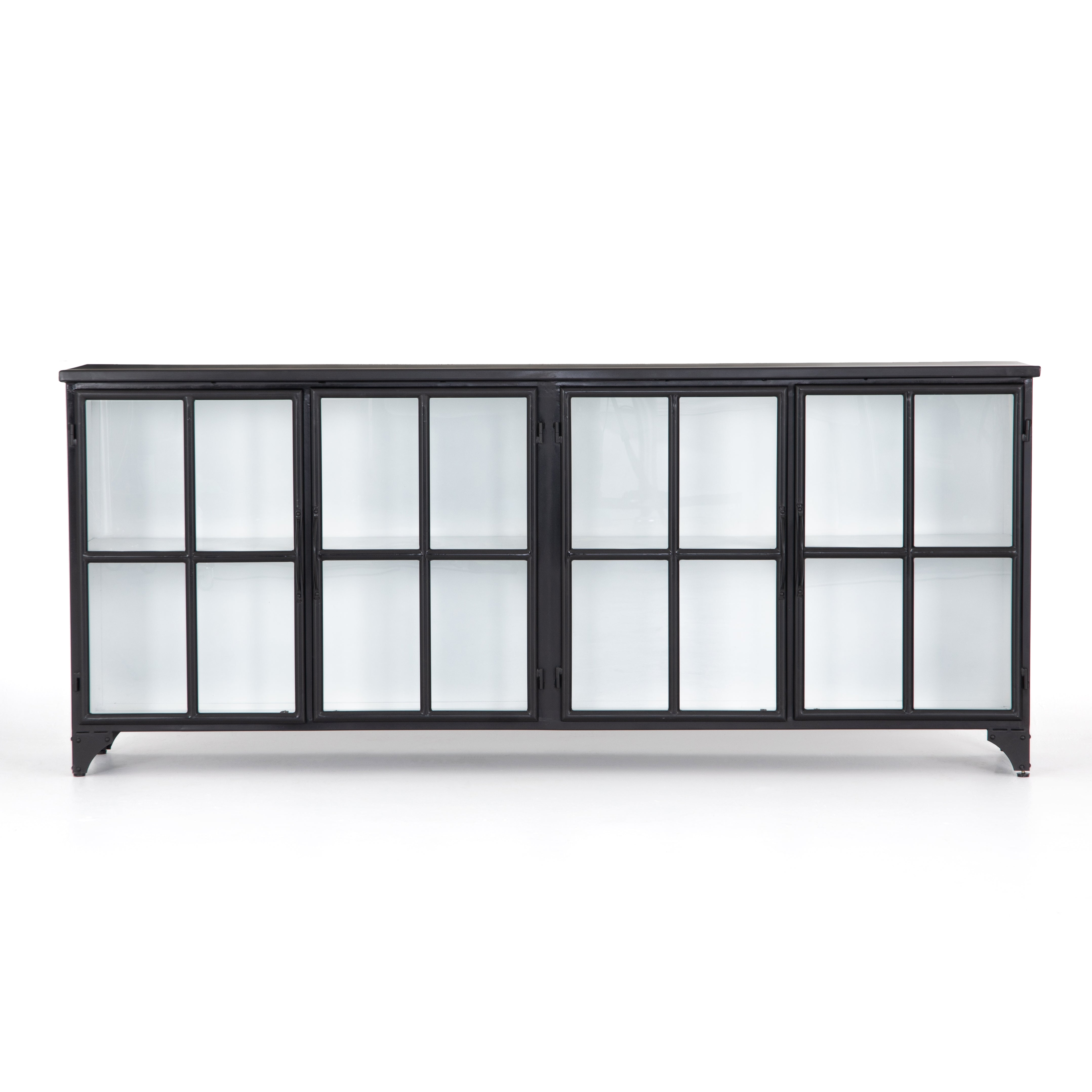 Featuring Camila Sideboard by Four Hands at Amethyst Home. A black iron frame with windowpane detail contrasts a stark white interior for an updated take on the traditional media console. Open-front glass doors and ample shelving maximize storage and display options.
Overall Dimensions: 94.50"W x 16"L x 39.50"HColors: Tempered Glass, Painted White, BlackMateri.  Amethyst Home provides interior design, new home construction design consulting, vintage area rugs, and lighting in the Miami metro area.