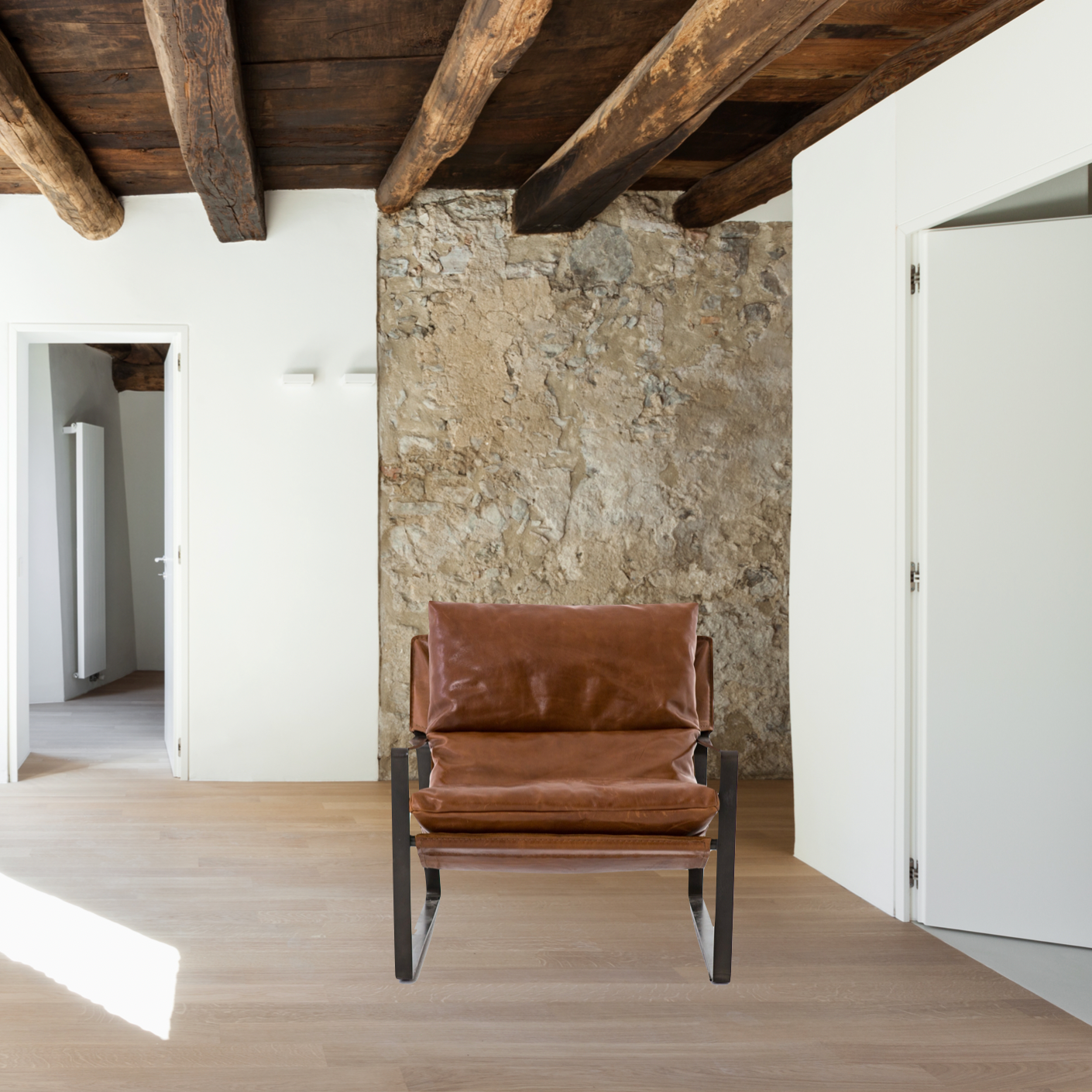 Featuring Emmett Sling Chair - Leather by Four Hands at Amethyst Home. Super stylish, effortlessly cool. Sling-style seating of tobacco-toned leather sits low and curved for a fresh take on a throwback form. Slim, gunmetal-finished iron framing ups the drama factor of an innately hip design.
Overall Dimensions: 29"W x 36"L x 29"HColors: Dakota Tobacco, Gun.  Amethyst Home provides interior design, new home construction design consulting, vintage area rugs, and lighting in the Park City metro area.