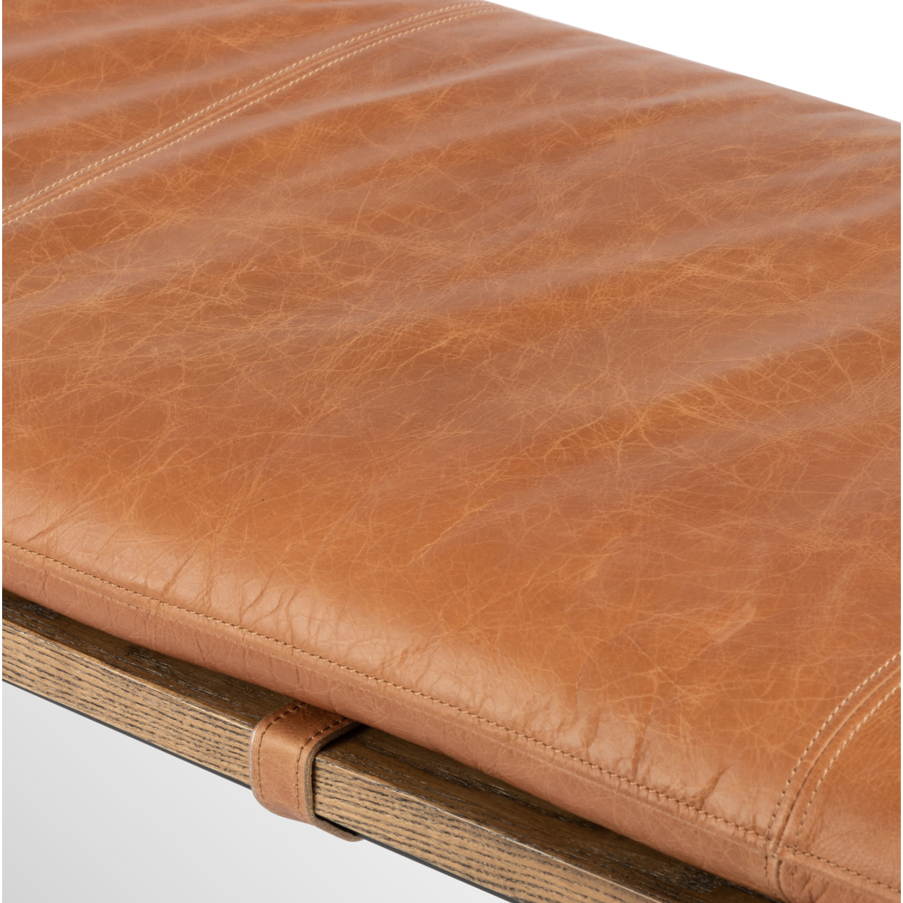 Featuring Gabine Accent Bench - Brandy by Four Hands at Amethyst Home. Airy, black-finished iron legs support a nettlewood dining bench of a chic, comfy layer of brandy top-grain leather on this Gabine Accent Bench - Brandy. A handsome piece to add to any bedroom, living room, or entryway. 
Overall Dimensions: 72"W x 18"L x 22"H
Colors: Midnight Iron, Toas.  Amethyst Home provides interior design, new home construction design consulting, vintage area rugs, and lighting in the Charlotte metro area.