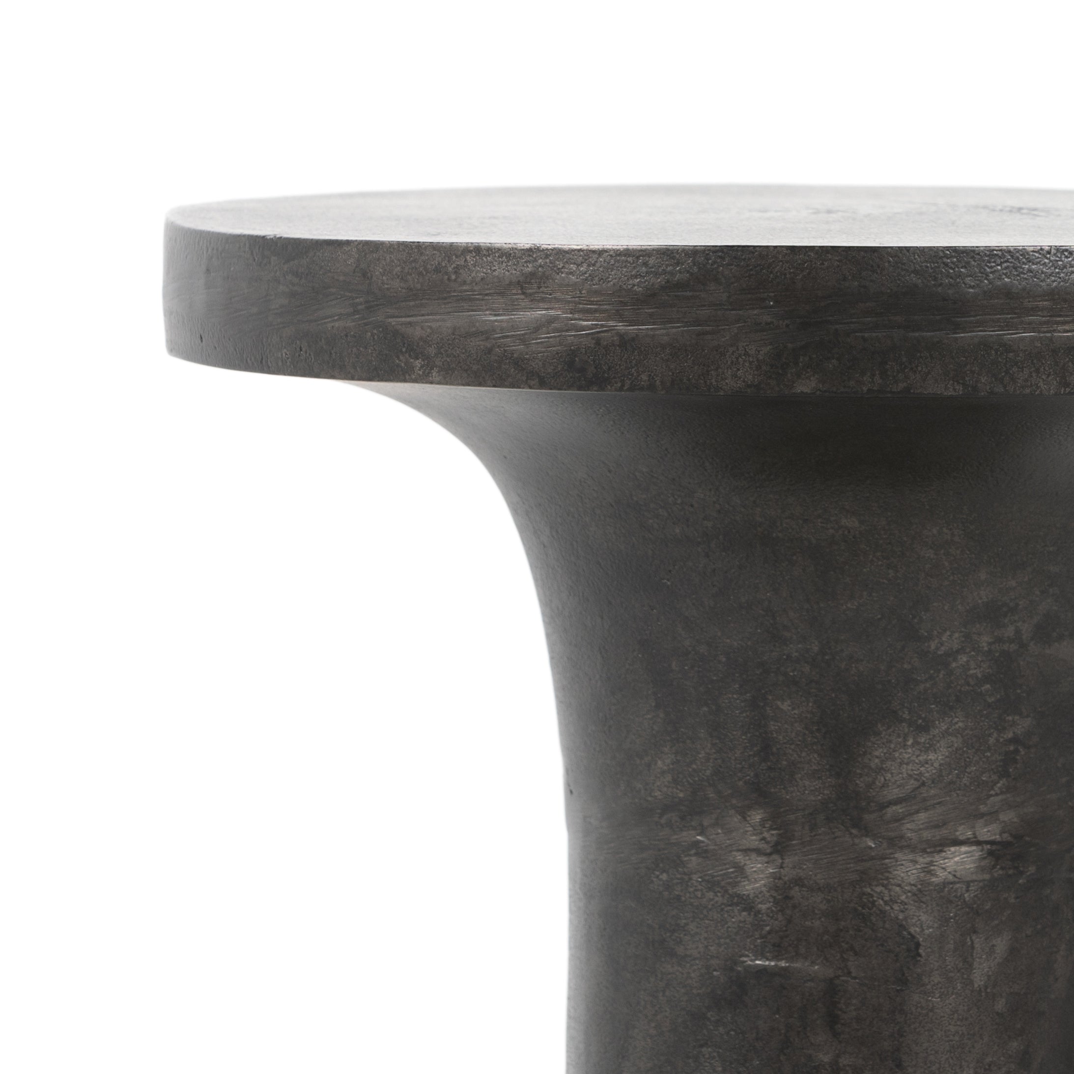 Featuring Gino End Table - Raw Black by Four Hands at Amethyst Home. Made from raw black cast aluminum, a dramatically tapered Gino End Table - Raw Black flaunts beautiful high/ low hues and subtle Brutalist vibes. Perfect for setting your book or favorite drink next to. 
Overall Dimensions: 13"W x 13"L x 20"H
Colors: Raw BlackMaterials: AluminumWeight.  Amethyst Home provides interior design, new home construction design consulting, vintage area rugs, and lighting in the Newport Beach metro area.