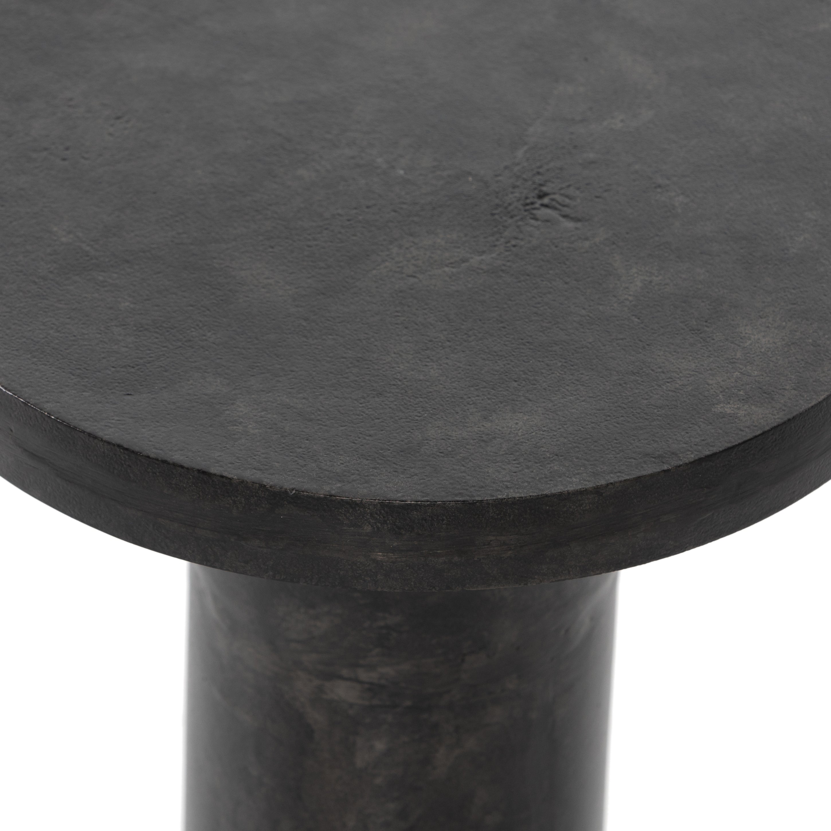 Featuring Gino End Table - Raw Black by Four Hands at Amethyst Home. Made from raw black cast aluminum, a dramatically tapered Gino End Table - Raw Black flaunts beautiful high/ low hues and subtle Brutalist vibes. Perfect for setting your book or favorite drink next to. 
Overall Dimensions: 13"W x 13"L x 20"H
Colors: Raw BlackMaterials: AluminumWeight: 13.  Amethyst Home provides interior design, new home construction design consulting, vintage area rugs, and lighting in the Charlotte metro area.