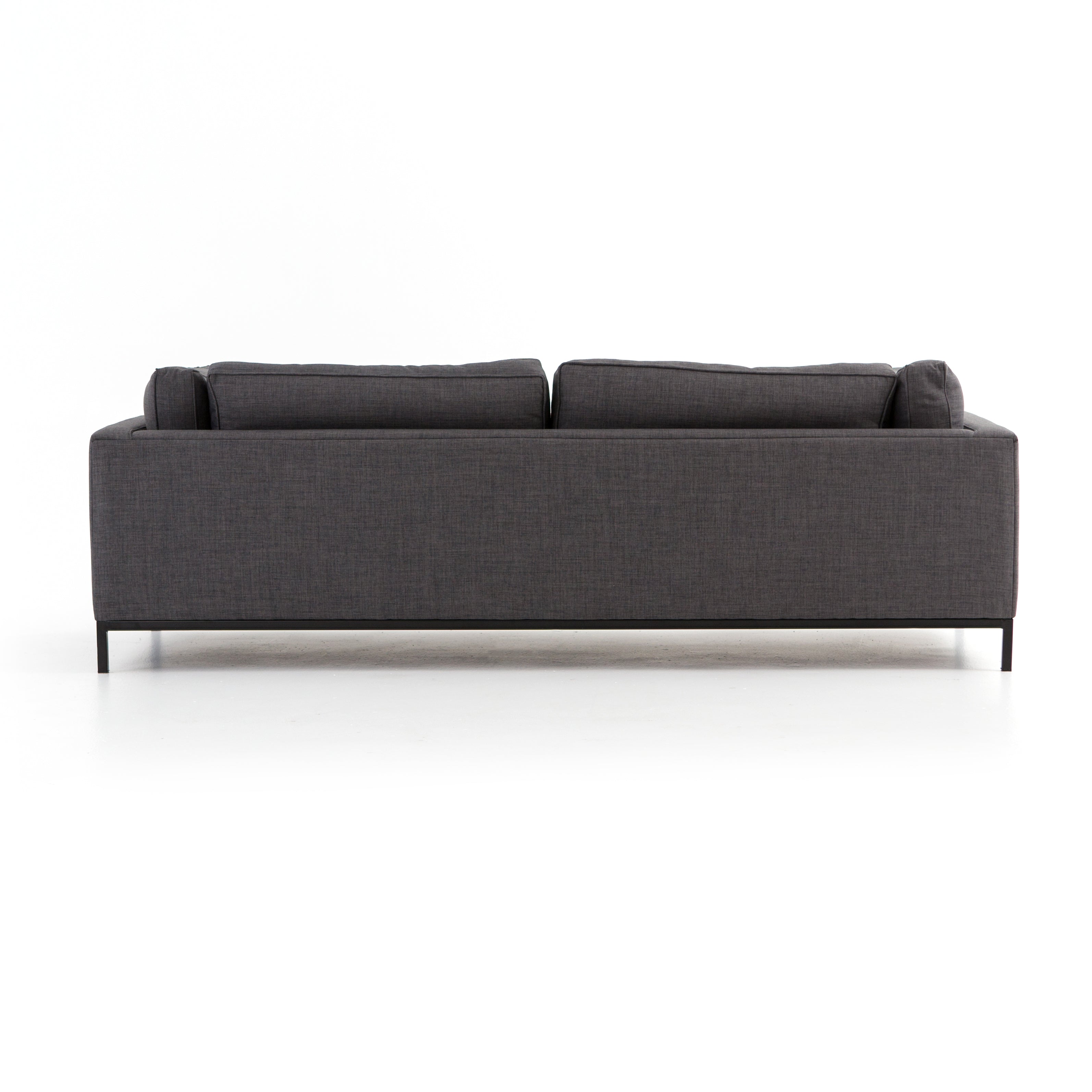 Featuring Grammercy Sofa - Charcoal by Four Hands at Amethyst Home. Streamlined yet comfortable!  We loved the subtle piping of the cushion details and stress-free color!  Flexible style, luxurious comfort and family-friendly upholstery. Clean, simple lines and black iron base keep everything casual and chic. Overall Dimensions: 92"W x 39.50"L x 30"HColor.  Amethyst Home provides interior design, new home construction design consulting, vintage area rugs, and lighting in the Washington metro area.