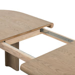 Featuring Jaylen Extension Dining Table - Yucca Oak by Four Hands at Amethyst Home. The rounded edges of this Jaylen Extension Dining Table - Yucca Oak are so dreamy. Made from solid oak with an oak veneer, this both a kid friendly and beautiful table to add to any dining room or kitchen area! The extension piece is self-storing and allows entertainment perf.  Amethyst Home provides interior design, new home construction design consulting, vintage area rugs, and lighting in the Seattle metro area.
