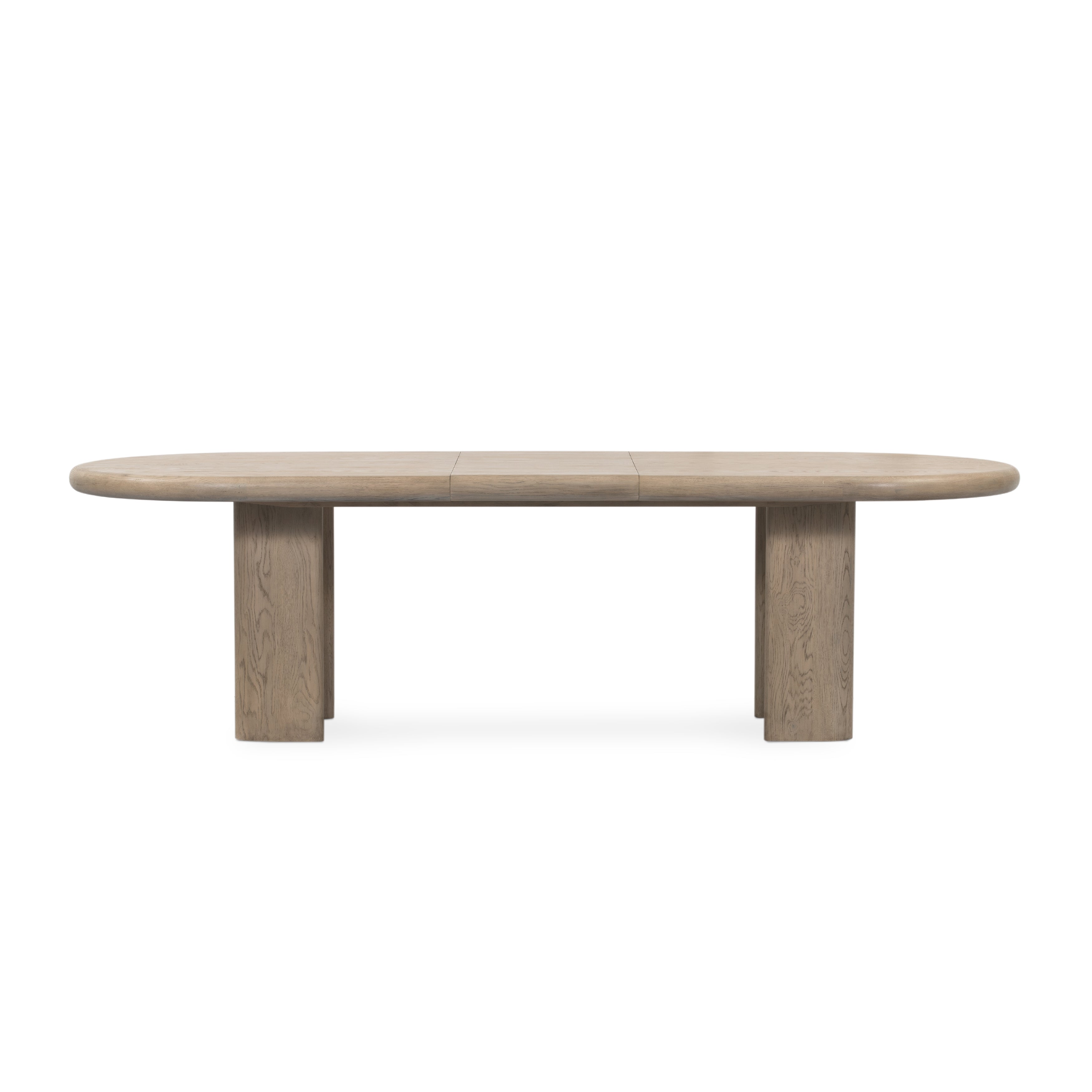 Featuring Jaylen Extension Dining Table - Yucca Oak by Four Hands at Amethyst Home. The rounded edges of this Jaylen Extension Dining Table - Yucca Oak are so dreamy. Made from solid oak with an oak veneer, this both a kid friendly and beautiful table to add to any dining room or kitchen area! The extension piece is self-storing and allows entertainment perf.  Amethyst Home provides interior design, new home construction design consulting, vintage area rugs, and lighting in the Houston metro area.