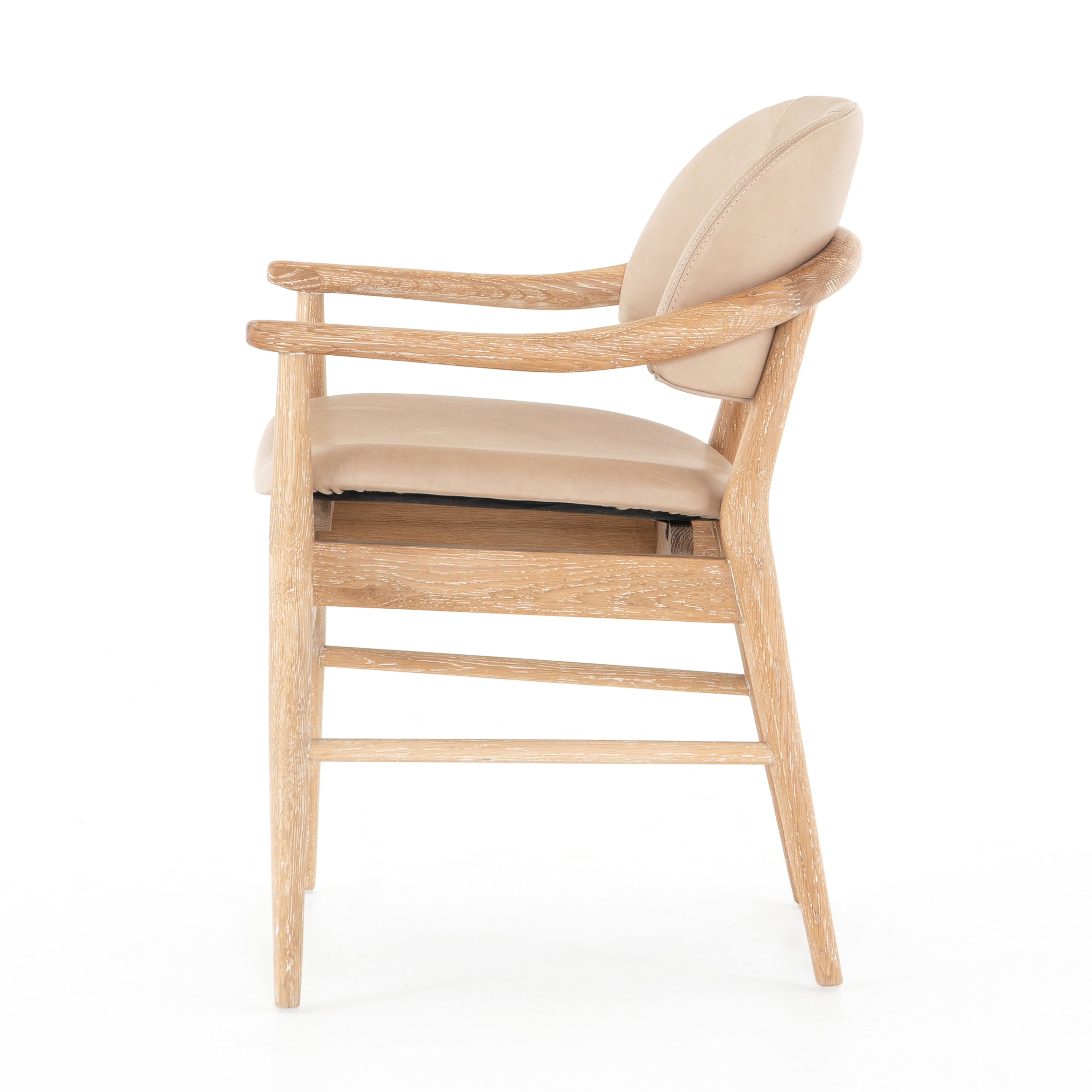 Featuring Josie Dining Chair - Vintage White Wash by Four Hands at Amethyst Home. Mid-century vibes meet modern materials with this Josie Dining Chair - Vintage White Wash. The whitewashed oak frame and float-like seating of top-grain leather add a comfy, light and bright look to any dining room. 
Overall Dimensions: 23"W x 23"L x 32.75"HColors: Harness Burlap.  Amethyst Home provides interior design, new home construction design consulting, vintage area rugs, and lighting in the Omaha metro area.