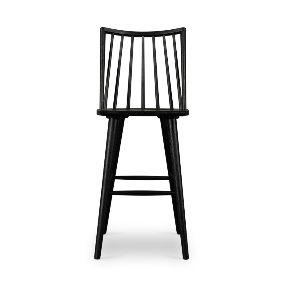 Featuring Lewis Windsor Bar + Counter Stool - Black Oak by Four Hands at Amethyst Home. A clean, modern take on the traditional Windsor. This tall and beautiful Windsor Bar Stool is wire-brushed to highlight the cathedral grain of black oak.
Bar Stool Overall Dimensions: 18.25"W x 20.25"L x 44.25"HSeat Depth: 16.50"Seat Height: 29"
Counter Stool Overall Dimens.  Amethyst Home provides interior design, new home construction design consulting, vintage area rugs, and lighting in the Omaha metro area.