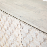 Featuring Rio Media Console - Round Cut White Wash by Four Hands at Amethyst Home. We love the texture of this Rio Media Console - Round Cut White Wash. Made from solid mango with spacious interior shelving and a rear cutout for card management, this is a beautiful piece to add to any living room or entertainment area. 
Overall Dimensions: 82"W x 18.25"L x 2.  Amethyst Home provides interior design, new home construction design consulting, vintage area rugs, and lighting in the Houston metro area.