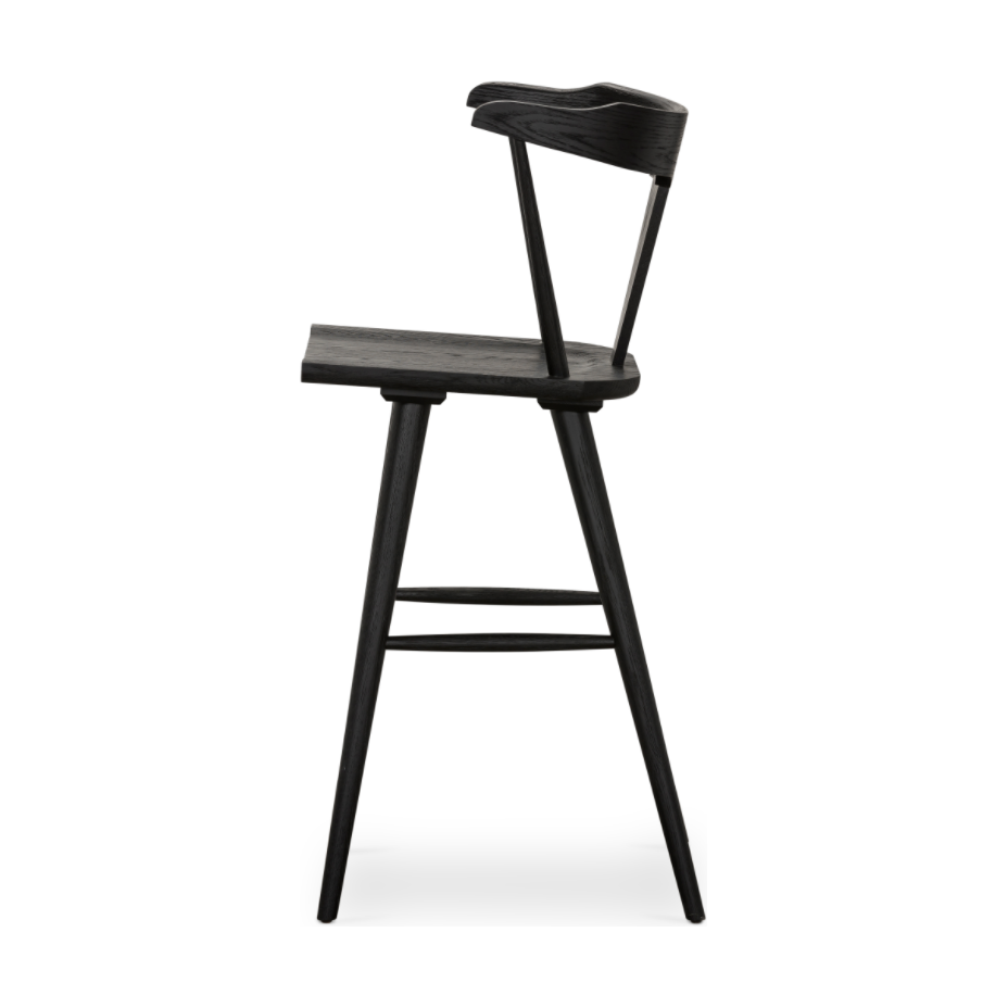 Featuring Ripley Black Oak Bar + Counter Stool by Four Hands at Amethyst Home. A fresh, bar-style take on mid-century Windsor seating is found in this Ripley Black Oak Bar + Counter Stool. Featuring a bowed, sculptural silhouette and soft black finish to highlight the natural grain of weathered oak.
Bar Overall Dimensions: 20.50"W x 20"L x 42.25"HSeat Dept.  Amethyst Home provides interior design, new home construction design consulting, vintage area rugs, and lighting in the Charlotte metro area.
