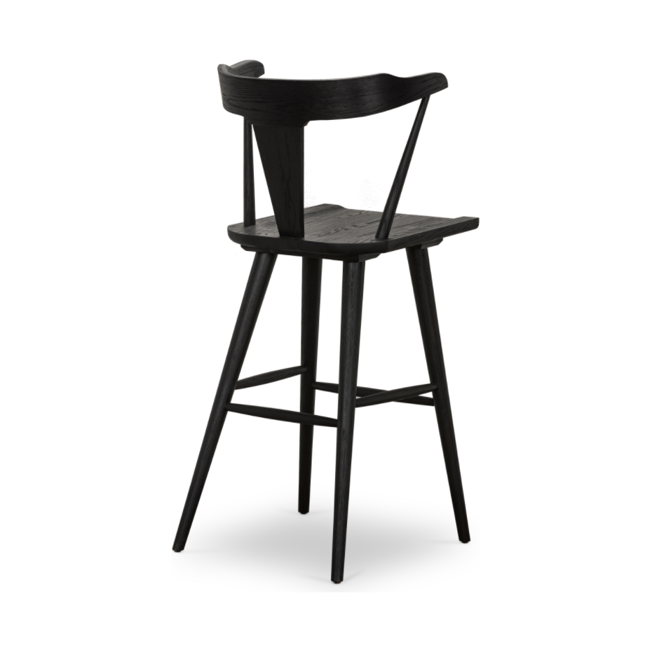Featuring Ripley Black Oak Bar + Counter Stool by Four Hands at Amethyst Home. A fresh, bar-style take on mid-century Windsor seating is found in this Ripley Black Oak Bar + Counter Stool. Featuring a bowed, sculptural silhouette and soft black finish to highlight the natural grain of weathered oak.
Bar Overall Dimensions: 20.50"W x 20"L x 42.25"HSeat.  Amethyst Home provides interior design, new home construction design consulting, vintage area rugs, and lighting in the Salt Lake City metro area.