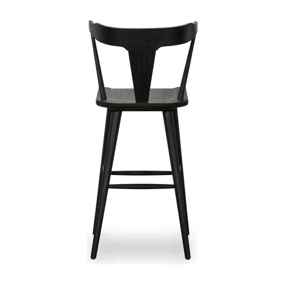 Featuring Ripley Black Oak Bar + Counter Stool by Four Hands at Amethyst Home. A fresh, bar-style take on mid-century Windsor seating is found in this Ripley Black Oak Bar + Counter Stool. Featuring a bowed, sculptural silhouette and soft black finish to highlight the natural grain of weathered oak.
Bar Overall Dimensions: 20.50"W x 20"L x 42.25"HSeat Depth.  Amethyst Home provides interior design, new home construction design consulting, vintage area rugs, and lighting in the Portland metro area.