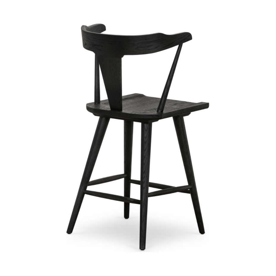 Featuring Ripley Black Oak Bar + Counter Stool by Four Hands at Amethyst Home. A fresh, bar-style take on mid-century Windsor seating is found in this Ripley Black Oak Bar + Counter Stool. Featuring a bowed, sculptural silhouette and soft black finish to highlight the natural grain of weathered oak.
Bar Overall Dimensions: 20.50"W x 20"L x 42.25"HSeat Dept.  Amethyst Home provides interior design, new home construction design consulting, vintage area rugs, and lighting in the San Diego metro area.