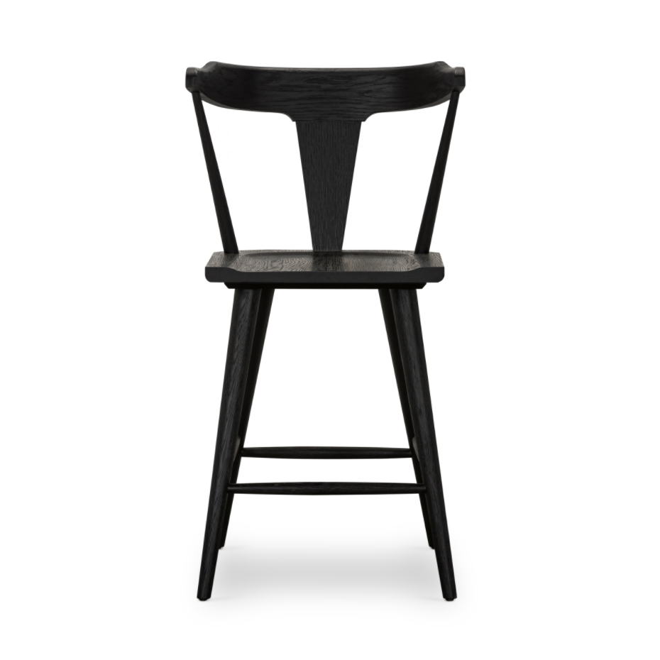 Featuring Ripley Black Oak Bar + Counter Stool by Four Hands at Amethyst Home. A fresh, bar-style take on mid-century Windsor seating is found in this Ripley Black Oak Bar + Counter Stool. Featuring a bowed, sculptural silhouette and soft black finish to highlight the natural grain of weathered oak.
Bar Overall Dimensions: 20.50"W x 20"L x 42.25"HSeat Depth: .  Amethyst Home provides interior design, new home construction design consulting, vintage area rugs, and lighting in the Boston metro area.