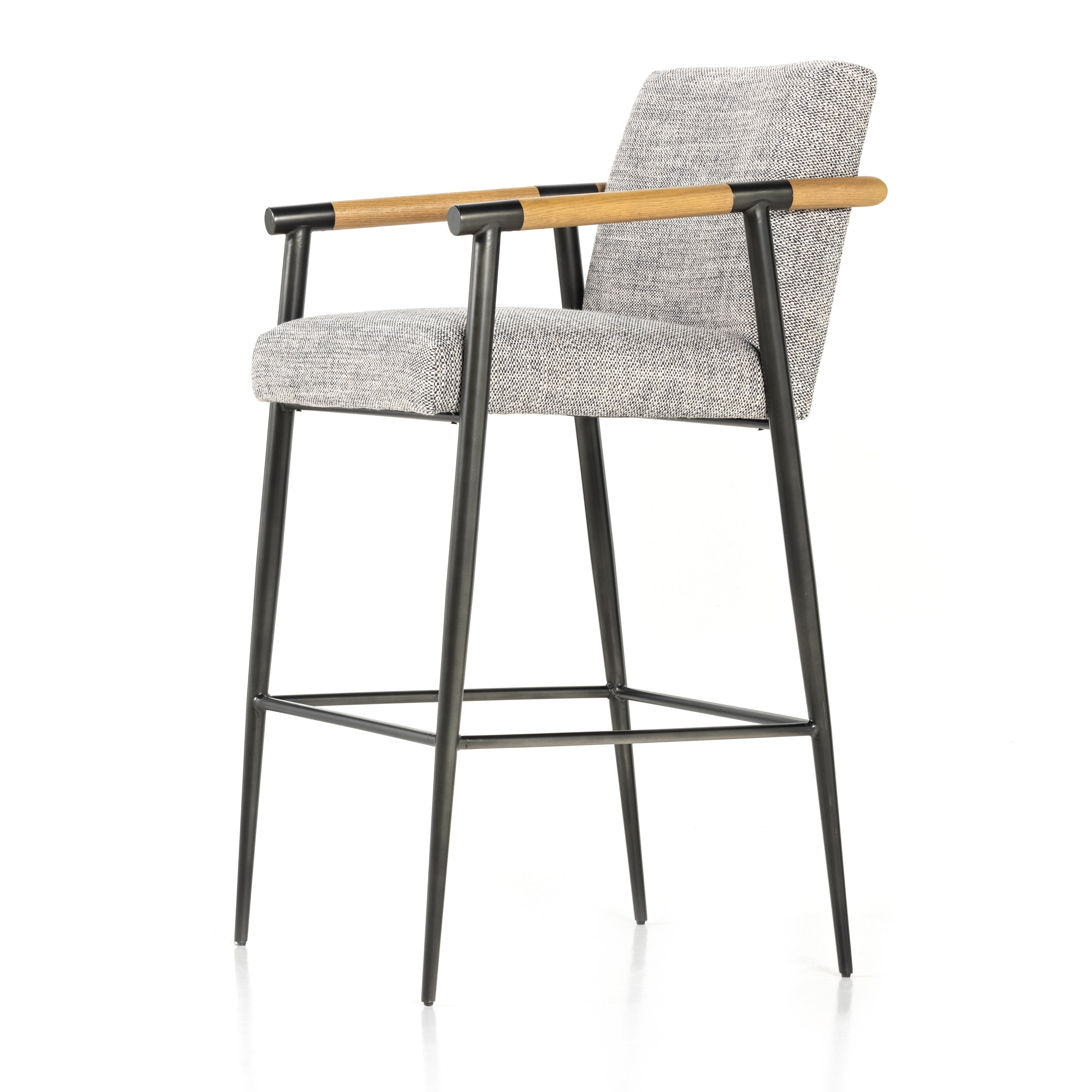 Featuring Rowen Thames Raven Counter Stool by Four Hands at Amethyst Home. We love the textural grey seating upholstered in a high-performance fabric on this Rowen Thames Raven Counter Stool. The angular solid oak arms and black-finished stainless steel framing is perfectly sized to elevate your bar or counter space.
Counter Stool Overall Dimensions: 23"W x .  Amethyst Home provides interior design, new home construction design consulting, vintage area rugs, and lighting in the Houston metro area.
