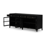 Featuring Shadow Box Media Console Table by Four Hands at Amethyst Home. This Shadow Box Media Console Table gives your inner collector a place to play. Frame prized possessions in a glass enclosure with matte-black metal and brass knobs.
Overall Dimensions: 69"W x 18"L x 29.25"H
Colors: Black, Tempered GlassMaterials: Iron, Tempered GlassWeight: 206.13 lb.  Amethyst Home provides interior design, new home construction design consulting, vintage area rugs, and lighting in the Charlotte metro area.