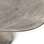 Featuring Simone Coffee Table - Antique Nickel by Four Hands at Amethyst Home. We love the oval shape of this Simone Coffee Table - Antique Nickel. The textural cast aluminum makes for a beautifully modern coffee table, with alluring highs and lows played up by a raw nickel finish.  Great indoors or out; cover or store indoors during inclement weather an.  Amethyst Home provides interior design, new home construction design consulting, vintage area rugs, and lighting in the Kansas City metro area.