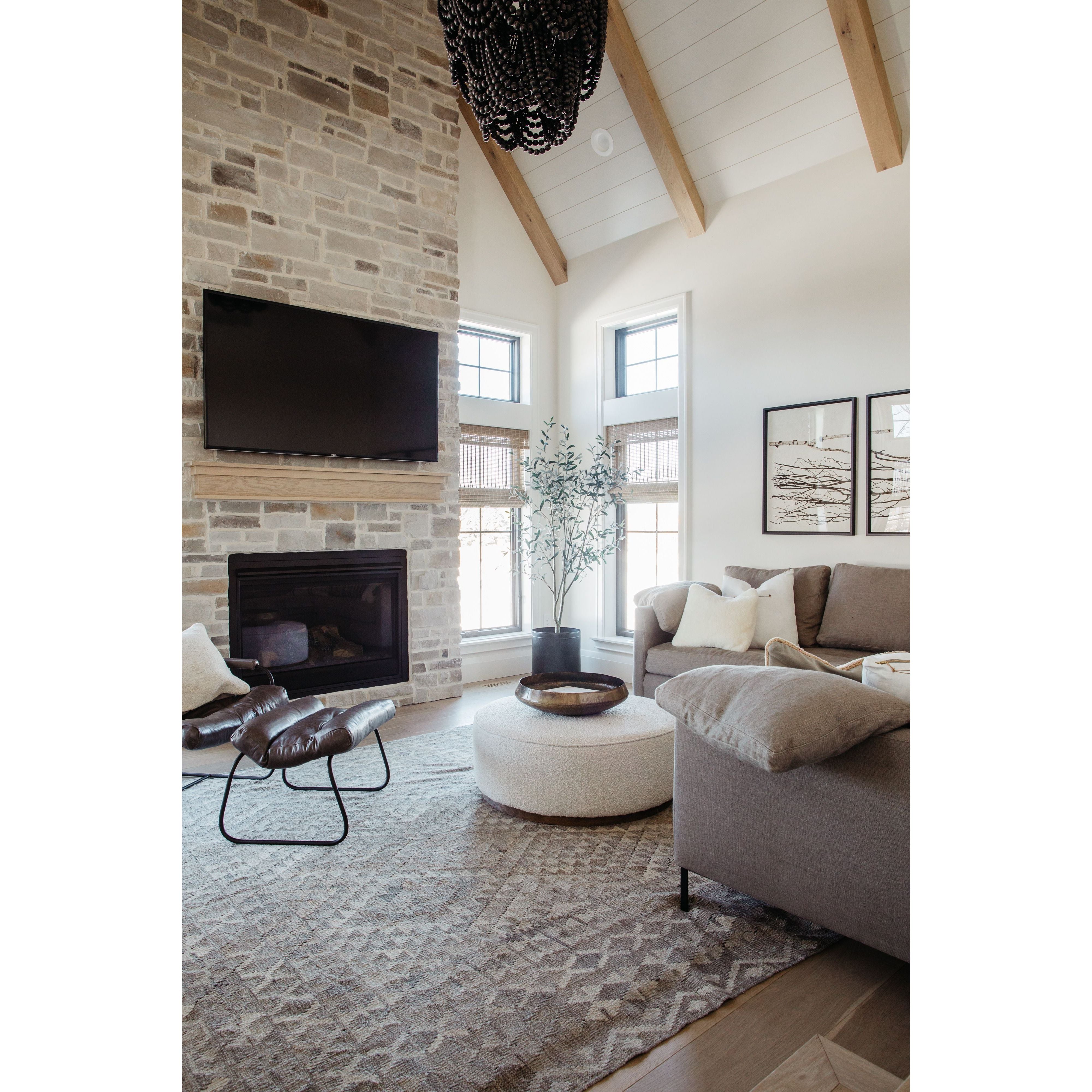 Featuring Sinclair Large Round Ottoman - Knoll Natural by Four Hands at Amethyst Home. This firm round ottoman of textural cream boucle makes a great coffee table or closet bench!
Overall Dimensions: 36"W x 36"L x 14.5"H
Colors: Distressed Natural, Knoll NaturalMaterials: Solid Parawood, 95% Pl, 5% PcFabric: PerformanceWeight: 26.46 lbVolume: 14.02 cu ft.  Amethyst Home provides interior design, new home construction design consulting, vintage area rugs, and lighting in the Seattle metro area.