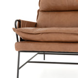 Featuring Taryn Chair - Chaps Saddle by Four Hands at Amethyst Home. A nod to relaxed modernism, playing up the natural depth of exclusive top-grain leather, with buckle details and low-slung styling crafting the hippest of vibes.
Overall Dimensions: 28"W x 37"L x 35"HColors: Chaps Saddle, GunmetalMaterials: Top Grain Leather, IronWeight: 36.16 lbVolume: 2.  Amethyst Home provides interior design, new home construction design consulting, vintage area rugs, and lighting in the Calabasas metro area.
